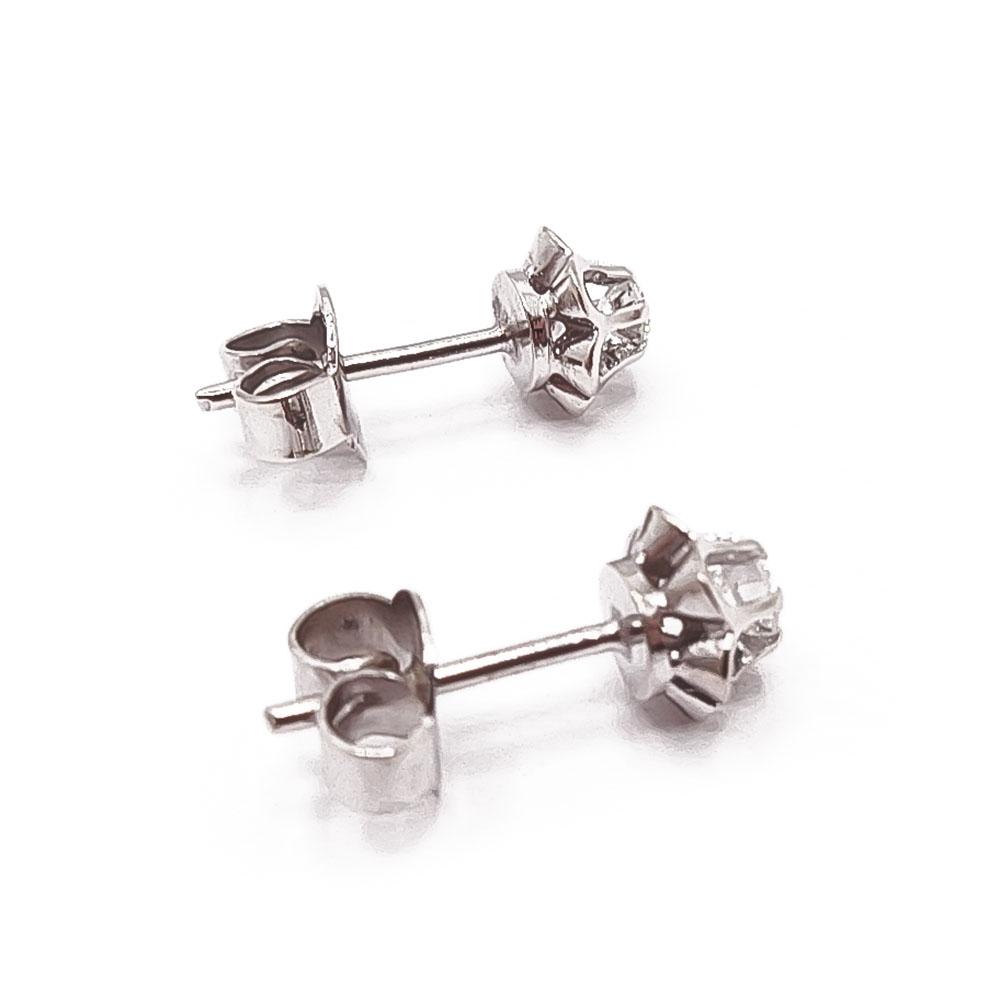 Valkokultaiset tim.korvakorut yht.0,1ct #1