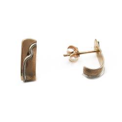 Tuotekuva Kaarevat korvakorut valkokultaisilla yksityiskohdilla